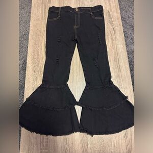 Girls black denim bell bottom jeans with denim fray and tear details. Never worn